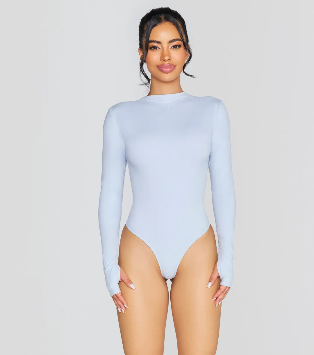 EXPOSED REVERSIBLE LONG SLEEVE BODYSUIT