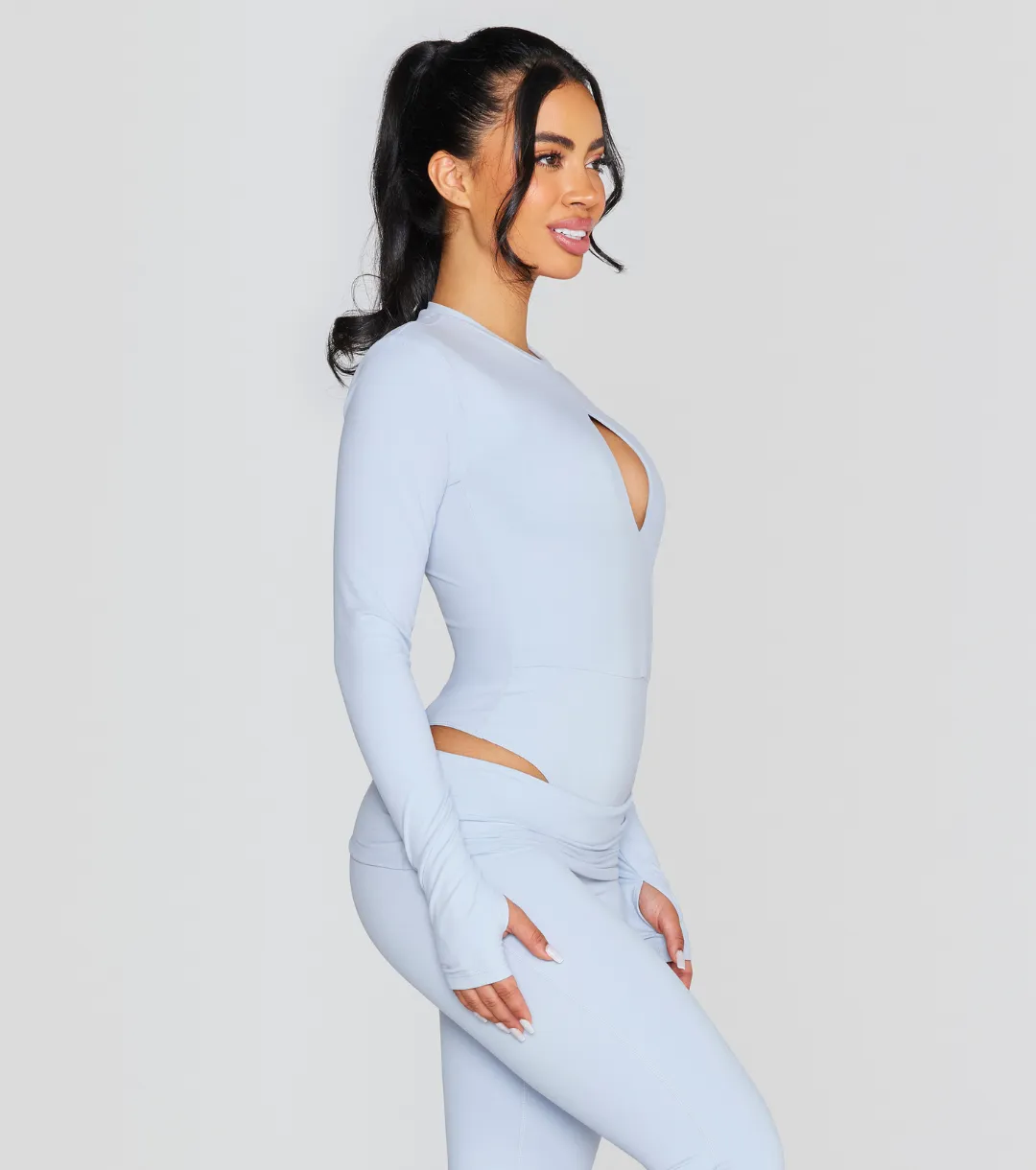 EXPOSED REVERSIBLE LONG SLEEVE BODYSUIT
