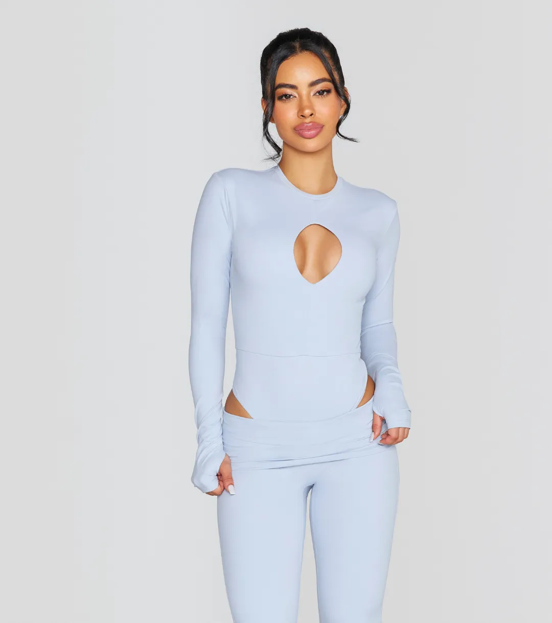 EXPOSED REVERSIBLE LONG SLEEVE BODYSUIT