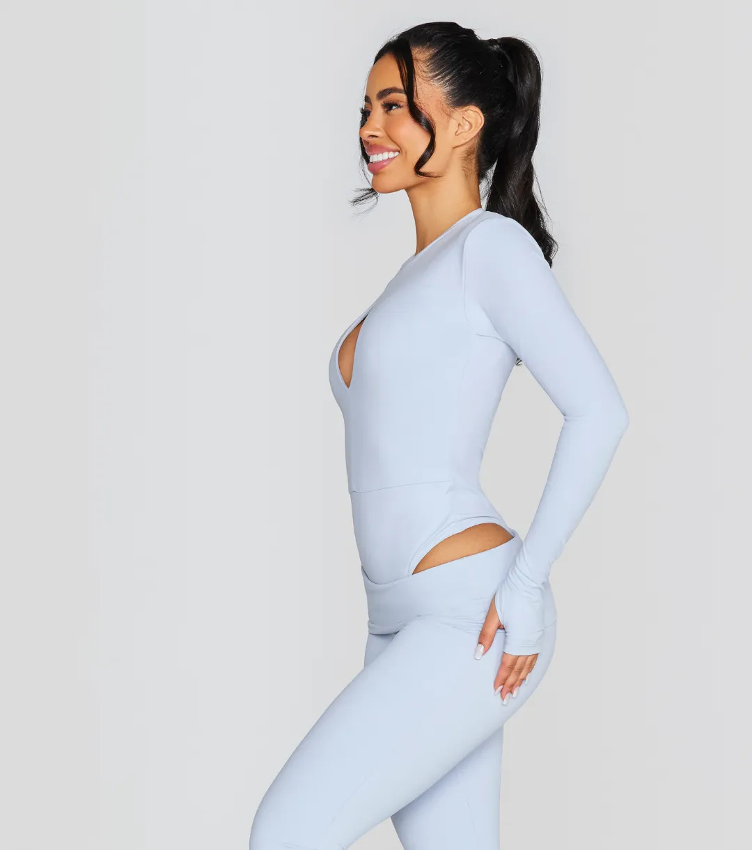 EXPOSED REVERSIBLE LONG SLEEVE BODYSUIT