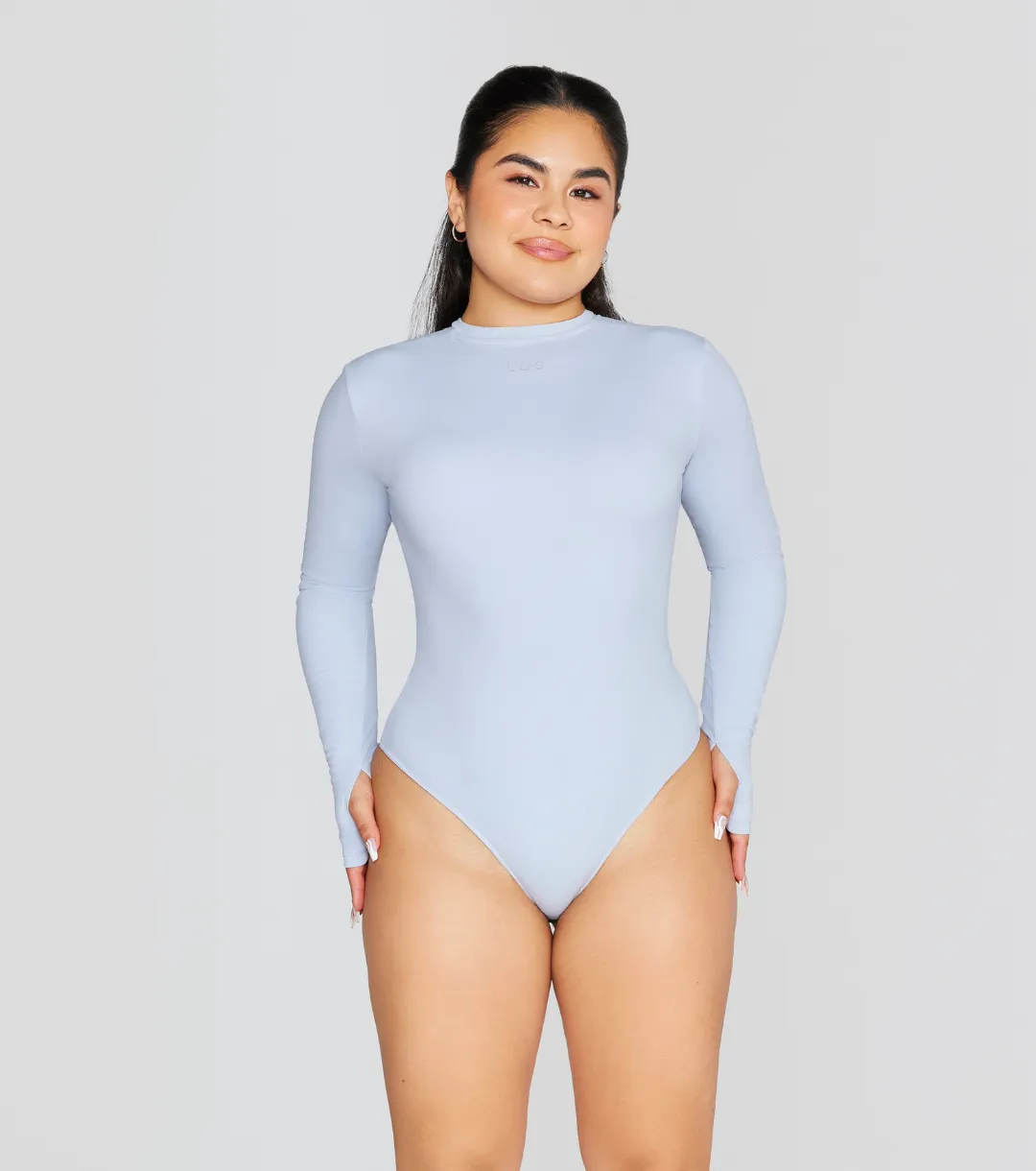 EXPOSED REVERSIBLE LONG SLEEVE BODYSUIT