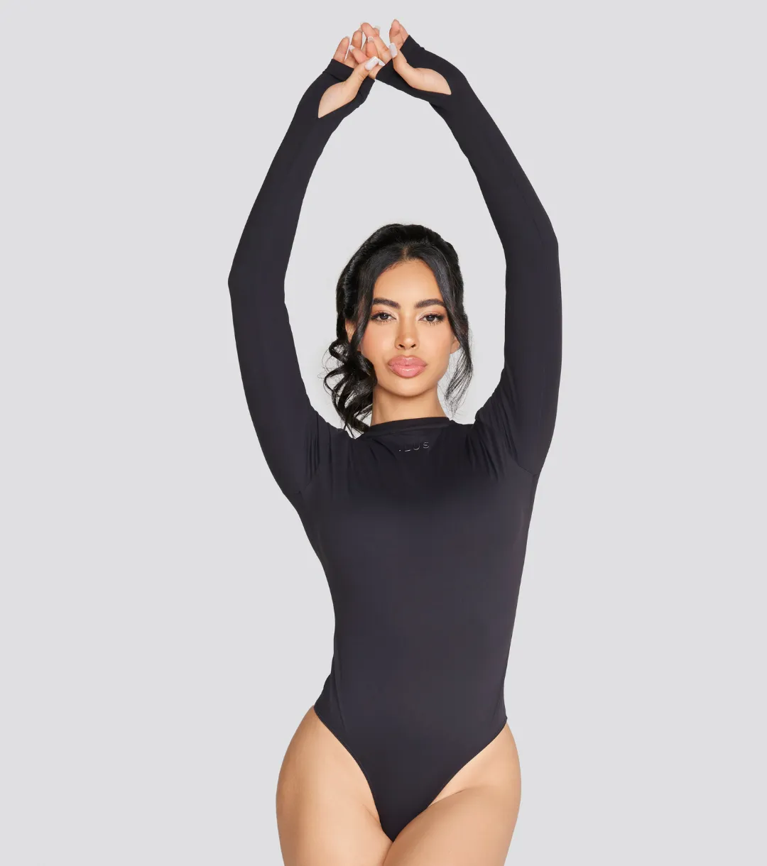 EXPOSED REVERSIBLE LONG SLEEVE BODYSUIT