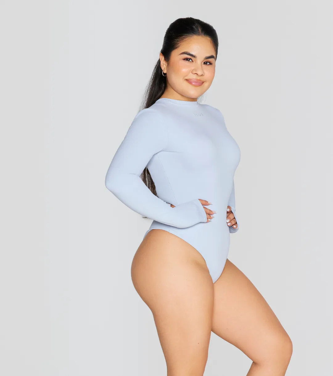 EXPOSED REVERSIBLE LONG SLEEVE BODYSUIT