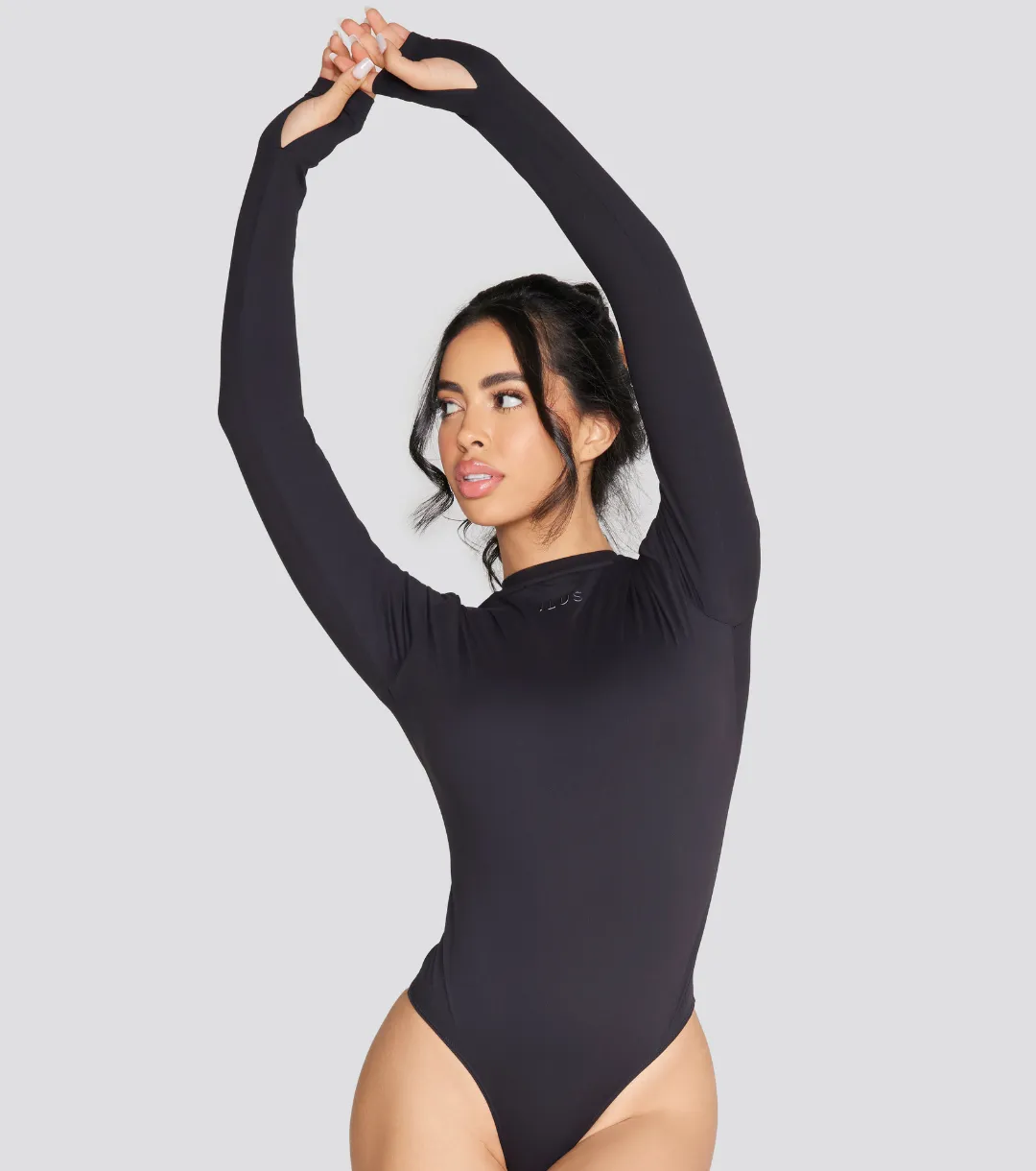 EXPOSED REVERSIBLE LONG SLEEVE BODYSUIT